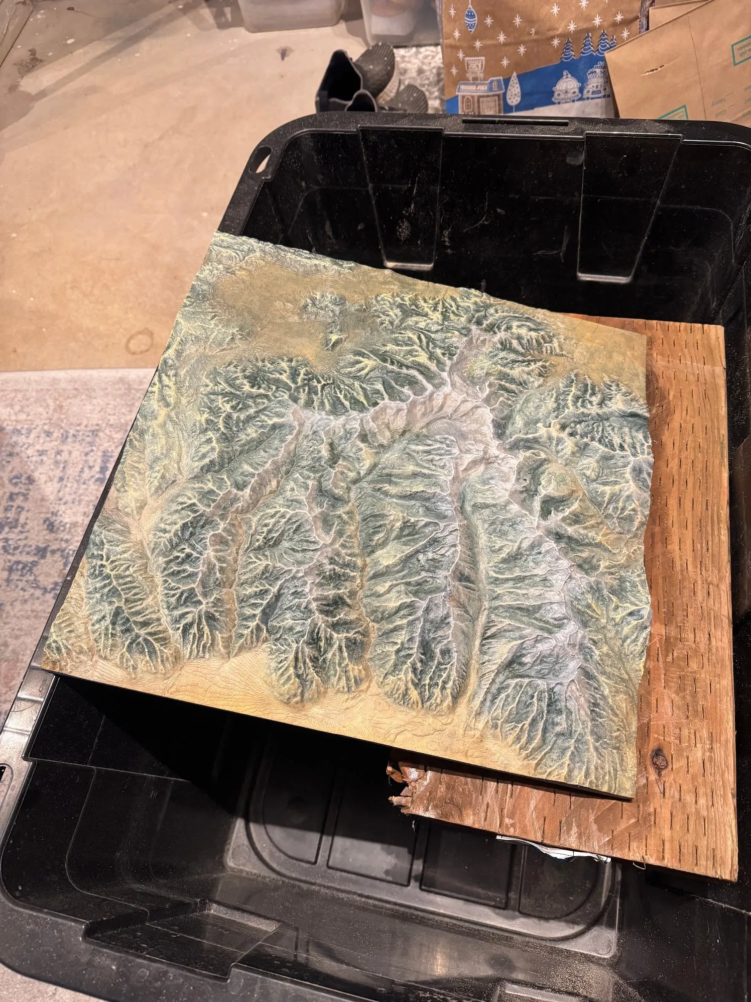 A painted 3D-printed relief map of a mountain range.